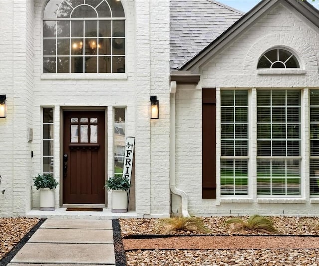 134 Brentwood Dr, Georgetown, TX 78628 - view of exterior entry with brick siding and a shingled roof