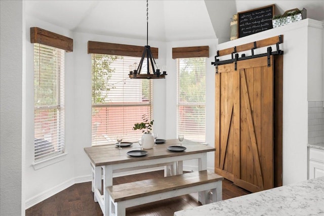 134 Brentwood Dr, Georgetown, TX 78628 - dining space featuring lofted ceiling, baseboards, and dark wood-style floors