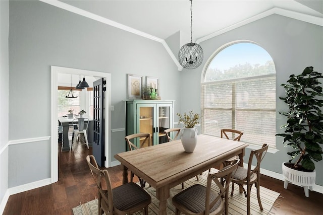 134 Brentwood Dr, Georgetown, TX 78628 - dining room featuring lofted ceiling, a chandelier, dark wood finished floors, baseboards, and ornamental molding