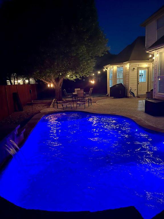 134 Brentwood Dr, Georgetown, TX 78628 - pool at twilight with a patio
