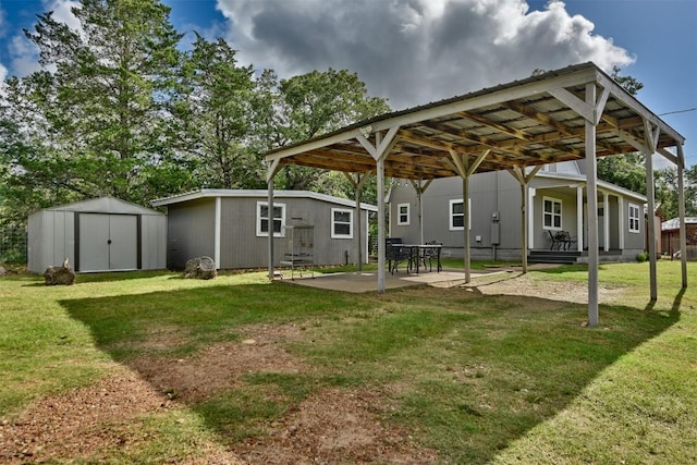 417 Big Bow, Smithville, TX 78957 - exterior space with a carport, a patio area, an outdoor structure, and a storage shed