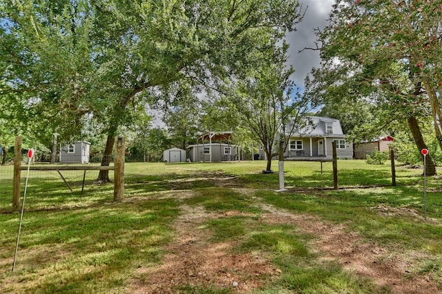 417 Big Bow, Smithville, TX 78957 - view of yard with a storage shed, fence, and an outdoor structure