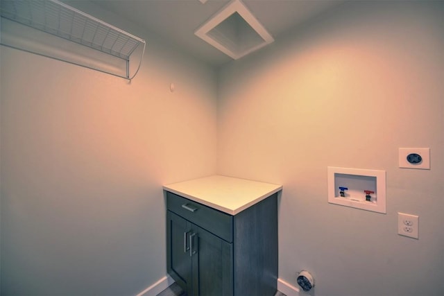 417 Big Bow, Smithville, TX 78957 - washroom featuring baseboards, cabinet space, electric dryer hookup, and washer hookup