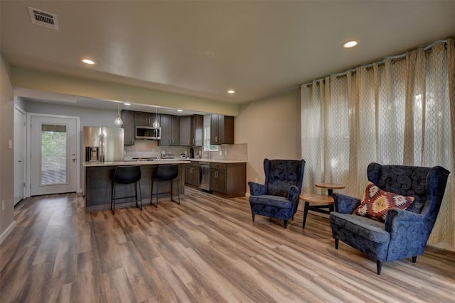 417 Big Bow, Smithville, TX 78957 - living area with light wood finished floors, visible vents, and recessed lighting