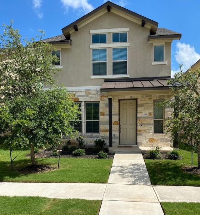 265 Spanish Star Trl, Dripping Springs, TX 78620 - view of front of house with stone siding, a standing seam roof, stucco siding, a front yard, and metal roof