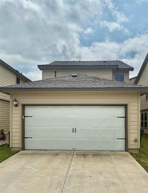 265 Spanish Star Trl, Dripping Springs, TX 78620 - garage featuring driveway