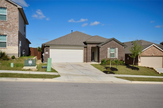 2504 Indian Clover Trl, Leander, TX 78641 - view of front of property featuring brick siding, a garage, and driveway