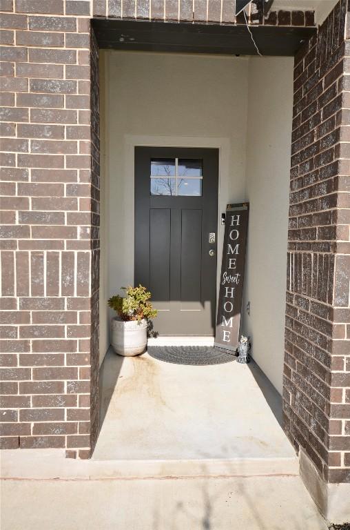 2504 Indian Clover Trl, Leander, TX 78641 - view of exterior entry featuring brick siding and stucco siding