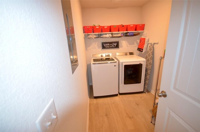 2504 Indian Clover Trl, Leander, TX 78641 - laundry area featuring light wood-type flooring and independent washer and dryer