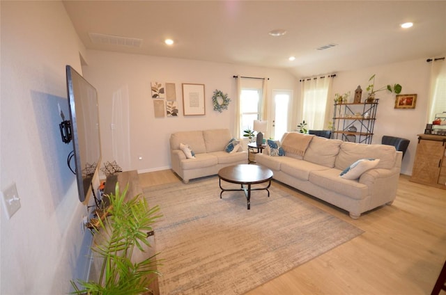 2504 Indian Clover Trl, Leander, TX 78641 - living room featuring light wood-style floors, recessed lighting, and baseboards