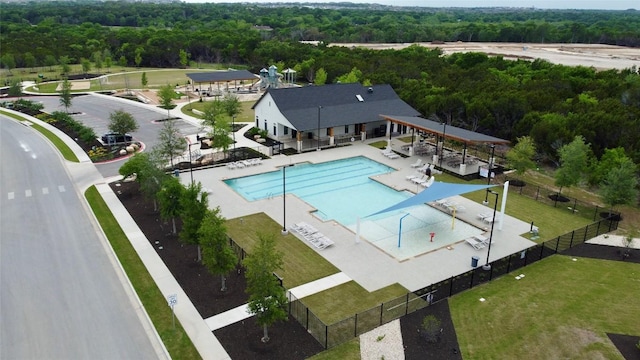 2504 Indian Clover Trl, Leander, TX 78641 - community pool featuring a view of trees and a patio