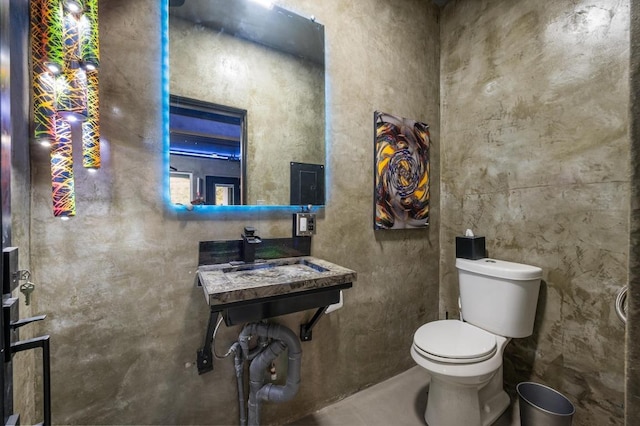 bathroom featuring toilet and a sink