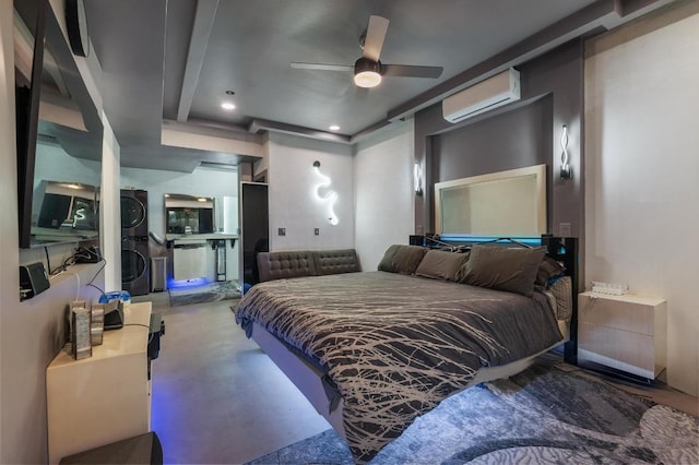 bedroom with concrete floors, stacked washer / drying machine, and an AC wall unit