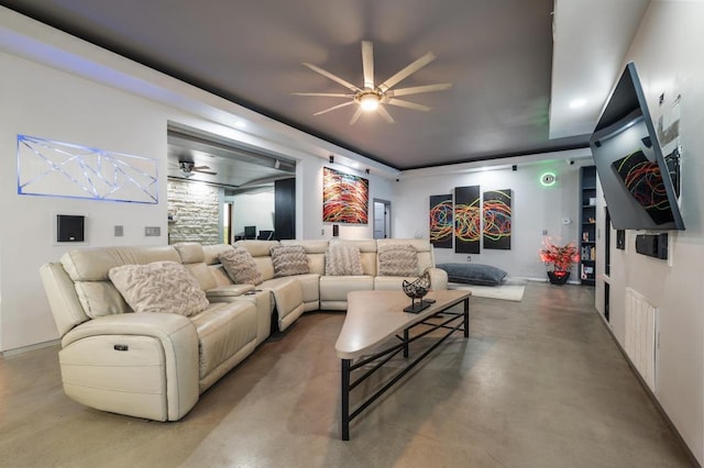 living area with visible vents, a ceiling fan, and concrete flooring