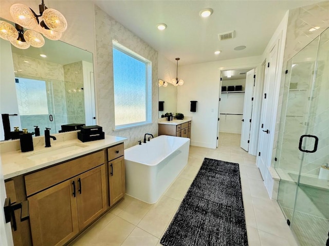 1603 Headwaters Blvd, Dripping Springs, TX 78620 - full bath featuring a freestanding tub, a shower stall, visible vents, and a sink