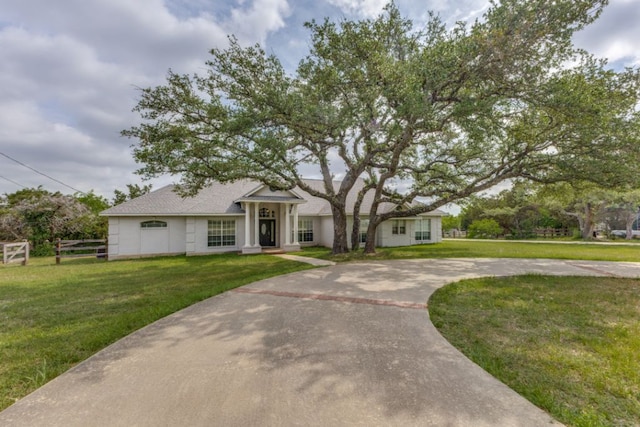 208 Saddletree Ln, Dripping Springs, TX 78620 - view of front of property with a front yard and curved driveway
