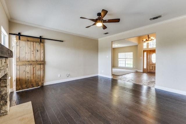 208 Saddletree Ln, Dripping Springs, TX 78620 - unfurnished living room featuring a ceiling fan, crown molding, hardwood / wood-style flooring, a chandelier, and baseboards