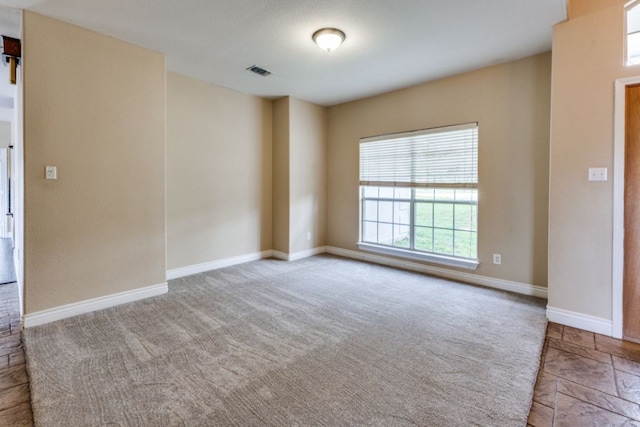 208 Saddletree Ln, Dripping Springs, TX 78620 - carpeted spare room featuring baseboards
