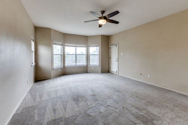 208 Saddletree Ln, Dripping Springs, TX 78620 - unfurnished room with a ceiling fan, baseboards, and carpet flooring