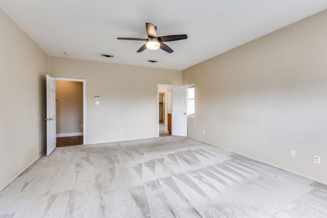 208 Saddletree Ln, Dripping Springs, TX 78620 - unfurnished bedroom featuring light colored carpet, baseboards, and ceiling fan