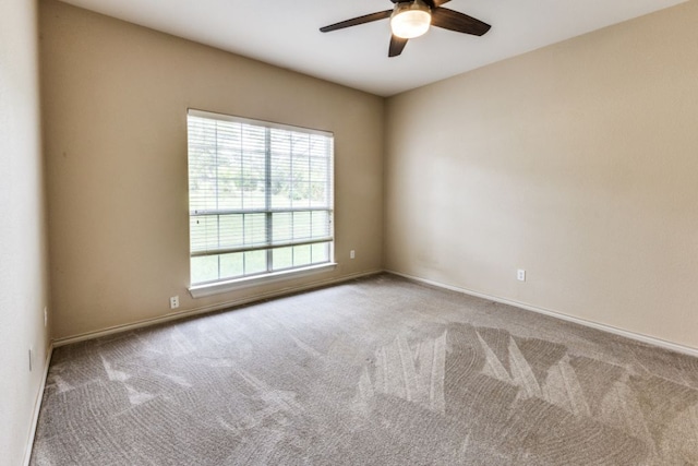 208 Saddletree Ln, Dripping Springs, TX 78620 - carpeted spare room with a ceiling fan and baseboards