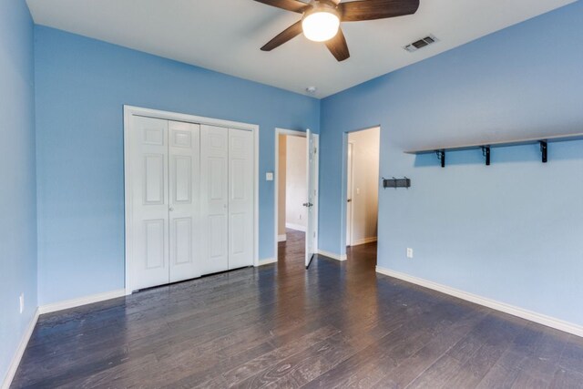 208 Saddletree Ln, Dripping Springs, TX 78620 - unfurnished bedroom with wood finished floors, a closet, baseboards, and ceiling fan