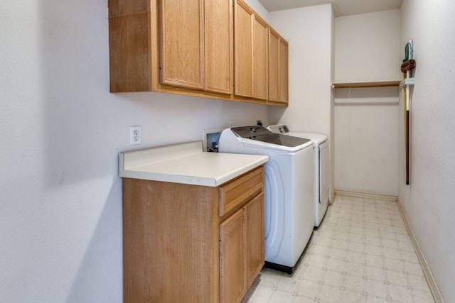 208 Saddletree Ln, Dripping Springs, TX 78620 - laundry room featuring light floors, washing machine and dryer, cabinet space, and baseboards
