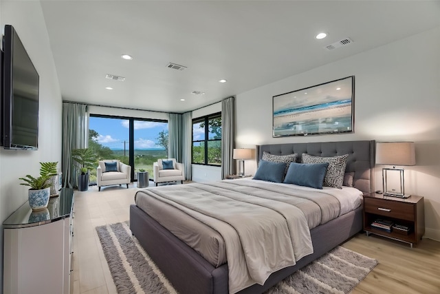 418 The Hills Rd, Horseshoe Bay, TX 78657 - bedroom featuring light wood finished floors, visible vents, and recessed lighting