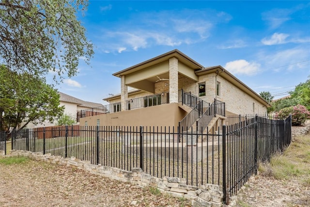 5004 Arrowhead Dr, Lago Vista, TX 78645 - back of house with stone siding and stairs