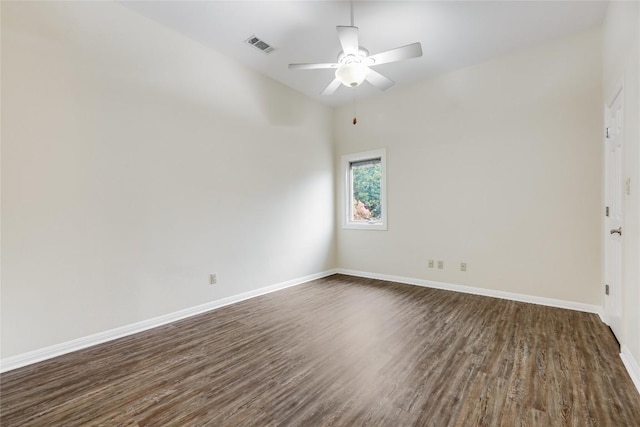 5004 Arrowhead Dr, Lago Vista, TX 78645 - unfurnished room with dark wood-type flooring, baseboards, and a ceiling fan