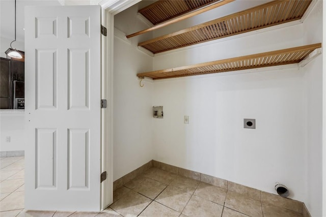 5004 Arrowhead Dr, Lago Vista, TX 78645 - laundry room featuring hookup for an electric dryer, washer hookup, and light tile patterned flooring
