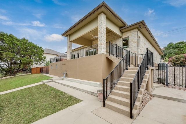 5004 Arrowhead Dr, Lago Vista, TX 78645 - view of home's exterior featuring stairs and stone siding
