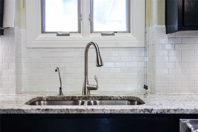 5004 Arrowhead Dr, Lago Vista, TX 78645 - kitchen view of a sink, tasteful backsplash, and light stone counters