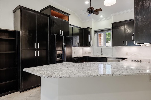 5004 Arrowhead Dr, Lago Vista, TX 78645 - kitchen with black appliances, dark cabinets, crown molding, a sink, and decorative backsplash