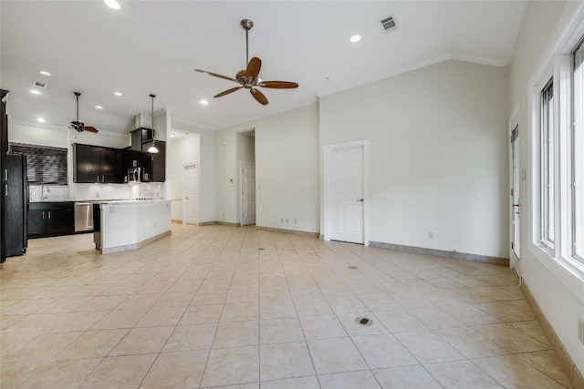 5004 Arrowhead Dr, Lago Vista, TX 78645 - unfurnished living room with a ceiling fan, ornamental molding, light tile patterned floors, lofted ceiling, and recessed lighting