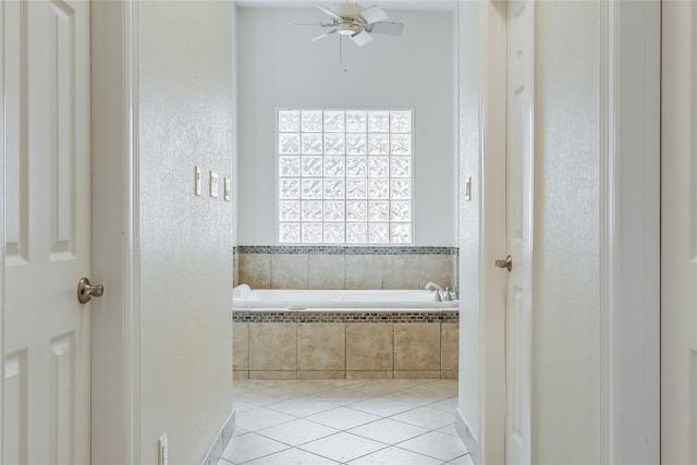 5004 Arrowhead Dr, Lago Vista, TX 78645 - bathroom with a bath, tile patterned flooring, and a ceiling fan