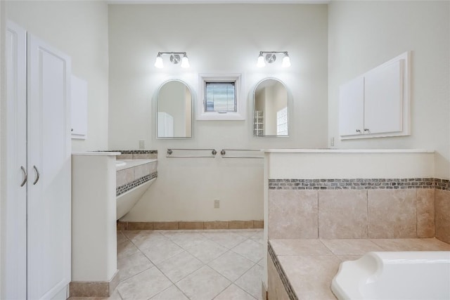 5004 Arrowhead Dr, Lago Vista, TX 78645 - bathroom with tile patterned floors, baseboards, and a tub
