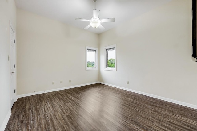 5004 Arrowhead Dr, Lago Vista, TX 78645 - spare room featuring dark wood-type flooring, baseboards, and a ceiling fan