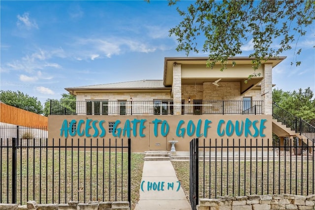 5004 Arrowhead Dr, Lago Vista, TX 78645 - view of front facade with stone siding and metal roof