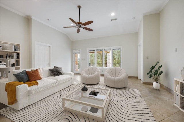 5004 Arrowhead Dr, Lago Vista, TX 78645 - living room featuring crown molding, ceiling fan, baseboards, light tile patterned flooring, and high vaulted ceiling