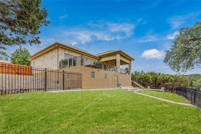 5004 Arrowhead Dr, Lago Vista, TX 78645 - rear view of house with stone siding and stairs