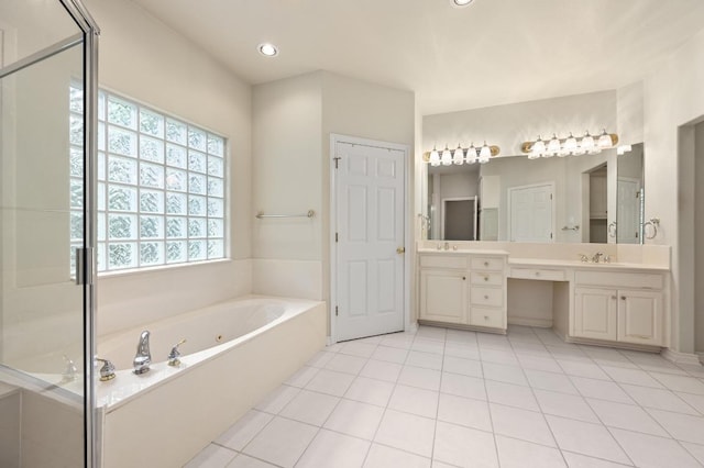 bathroom featuring recessed lighting, a bath, tile patterned flooring, and vanity