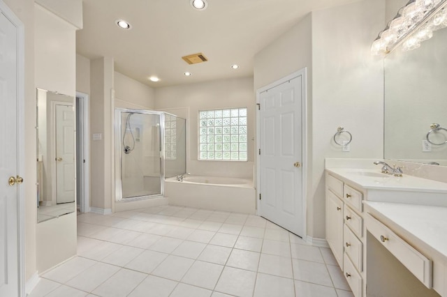 full bath featuring recessed lighting, visible vents, vanity, a garden tub, and a stall shower