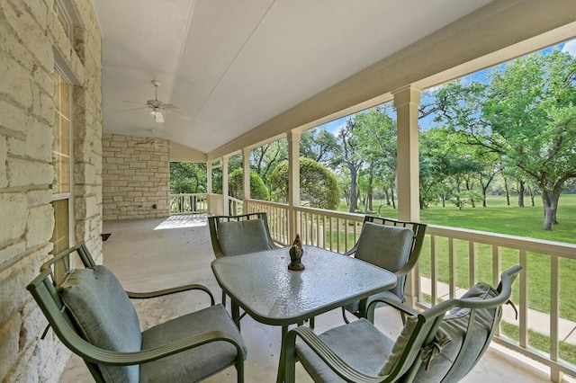 view of patio with a ceiling fan and outdoor dining space