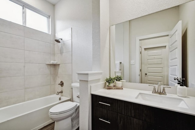 full bath featuring shower / bath combination, toilet, and vanity