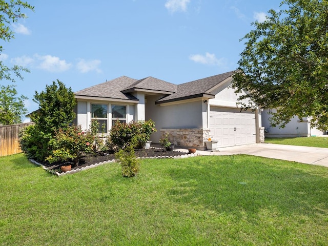 180 Tailwind Dr, Kyle, TX 78640 - view of front of property with a garage, concrete driveway, stucco siding, and stone siding