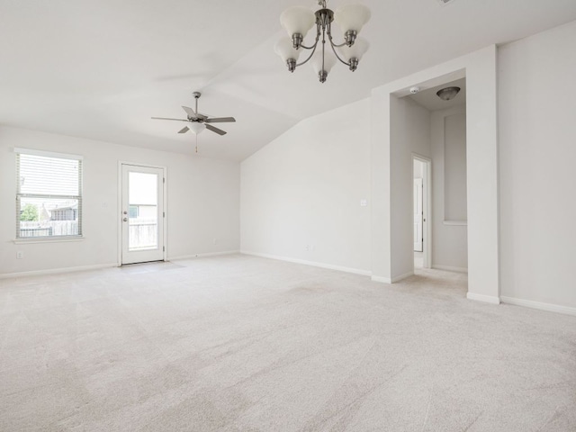 180 Tailwind Dr, Kyle, TX 78640 - unfurnished room featuring vaulted ceiling, ceiling fan, light colored carpet, and a chandelier