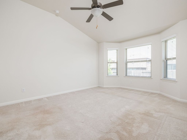 180 Tailwind Dr, Kyle, TX 78640 - unfurnished room featuring light colored carpet, vaulted ceiling, ceiling fan, and a smoke detector