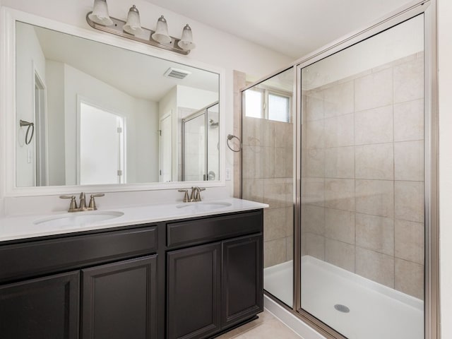 180 Tailwind Dr, Kyle, TX 78640 - full bathroom with a stall shower and double vanity