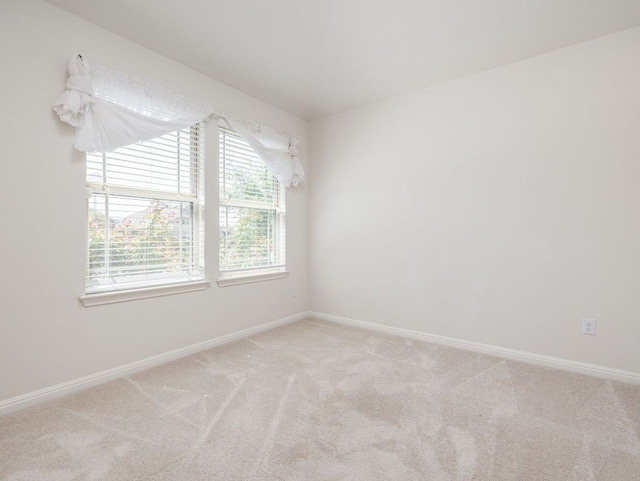 180 Tailwind Dr, Kyle, TX 78640 - empty room with carpet floors and baseboards